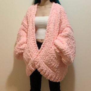 Handknit light pink chunky chenille knit cardigan with heart buttons and pockets